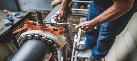 Removing a Stuck Pipe Clamp Without Tools